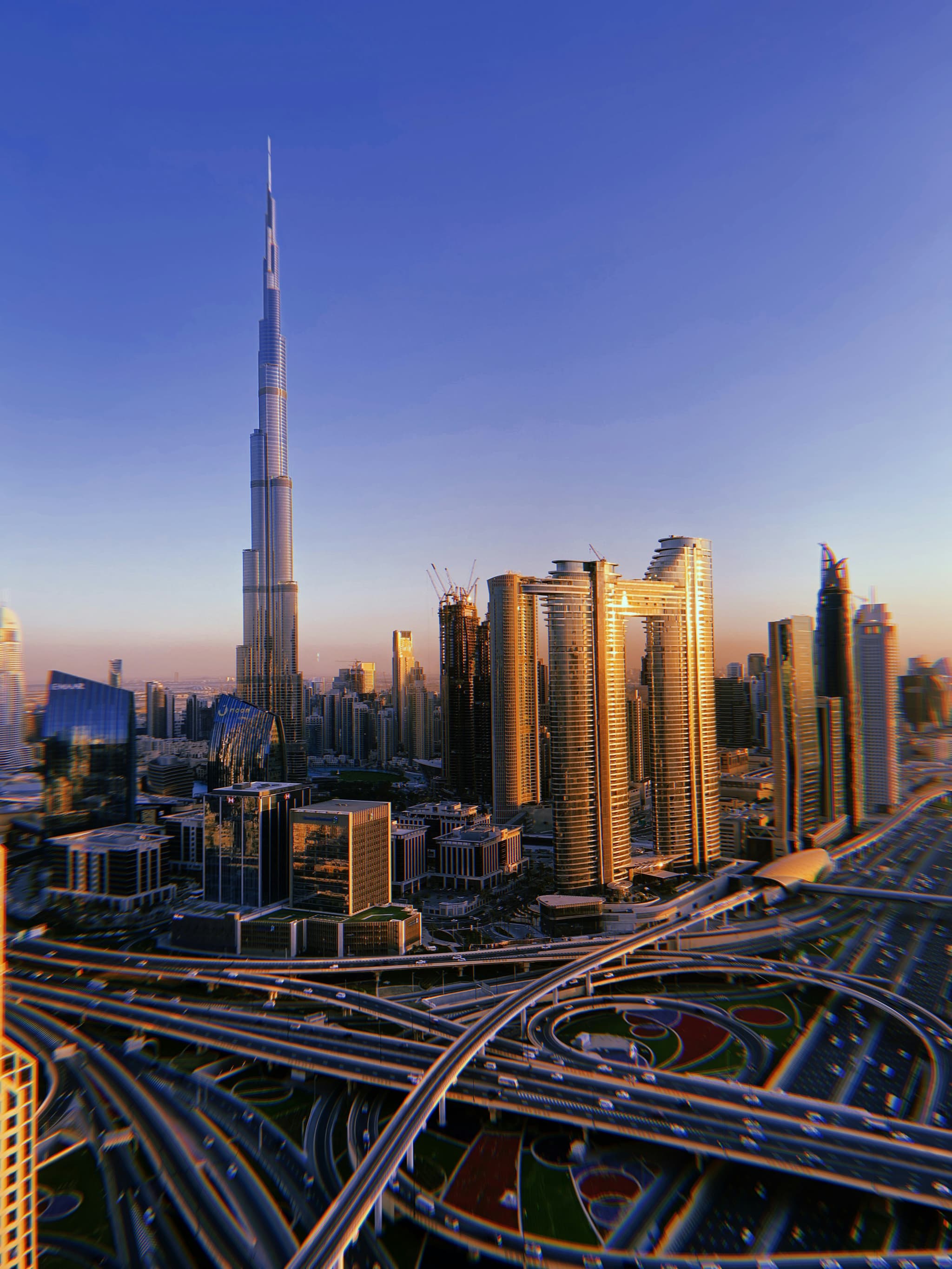 Downtown Dubai at dusk, looking along Sheikh Zayed Road towards the Burj Khalifa